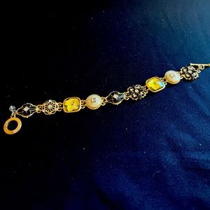 Gold-Toned Bracelet with Black and Ivory Floral Design